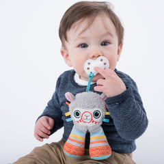 Baby using BooginHead PaciPal pacifier holder