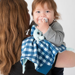 Mom holding baby using BooginHead PaciPal Teether Blanket Elephant