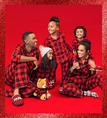Family in matching family pajamas in buffalo check from Target