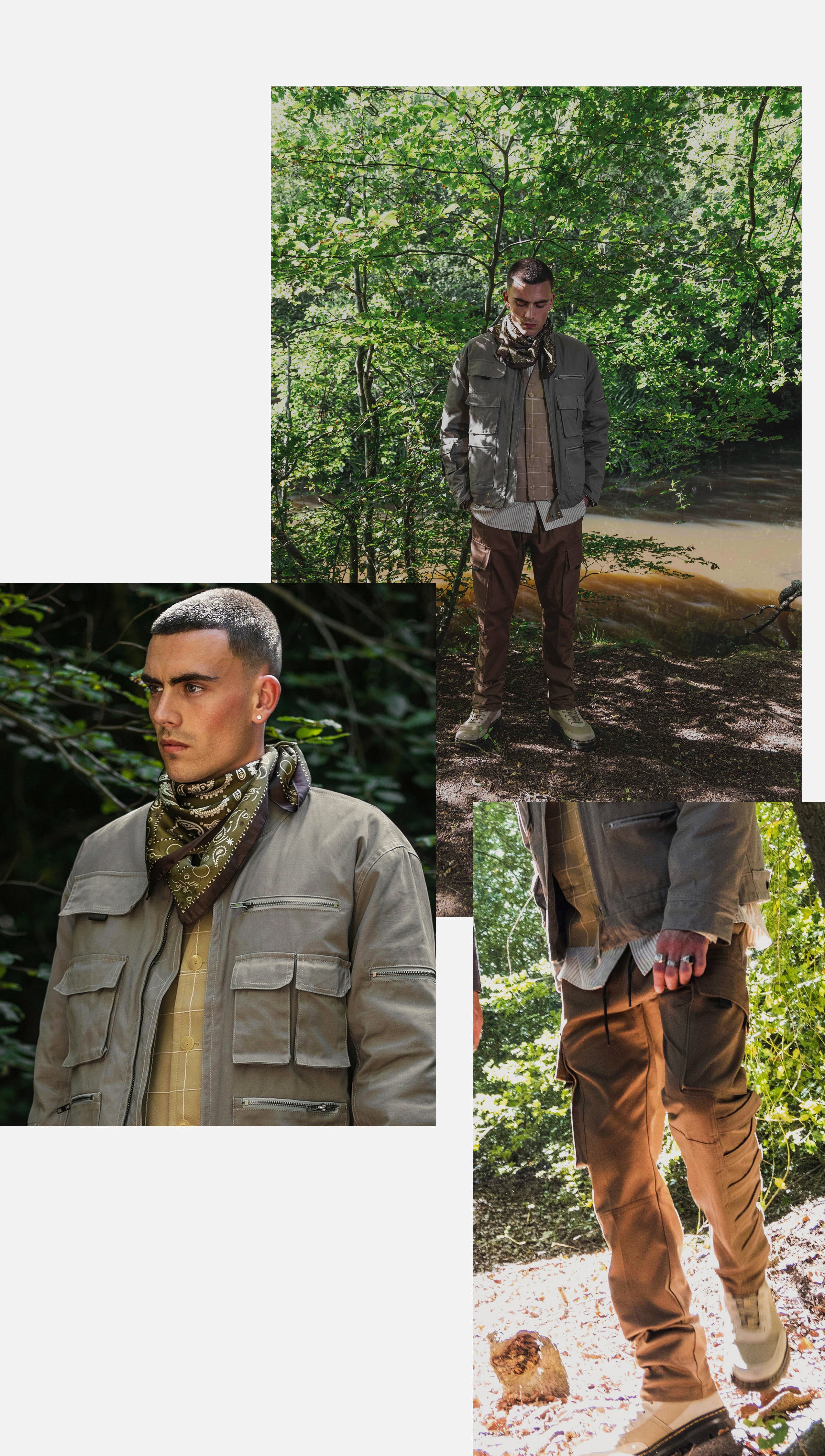 A male model is wearing a taupe cropped cargo jacket and brown cargo pants in a forest.