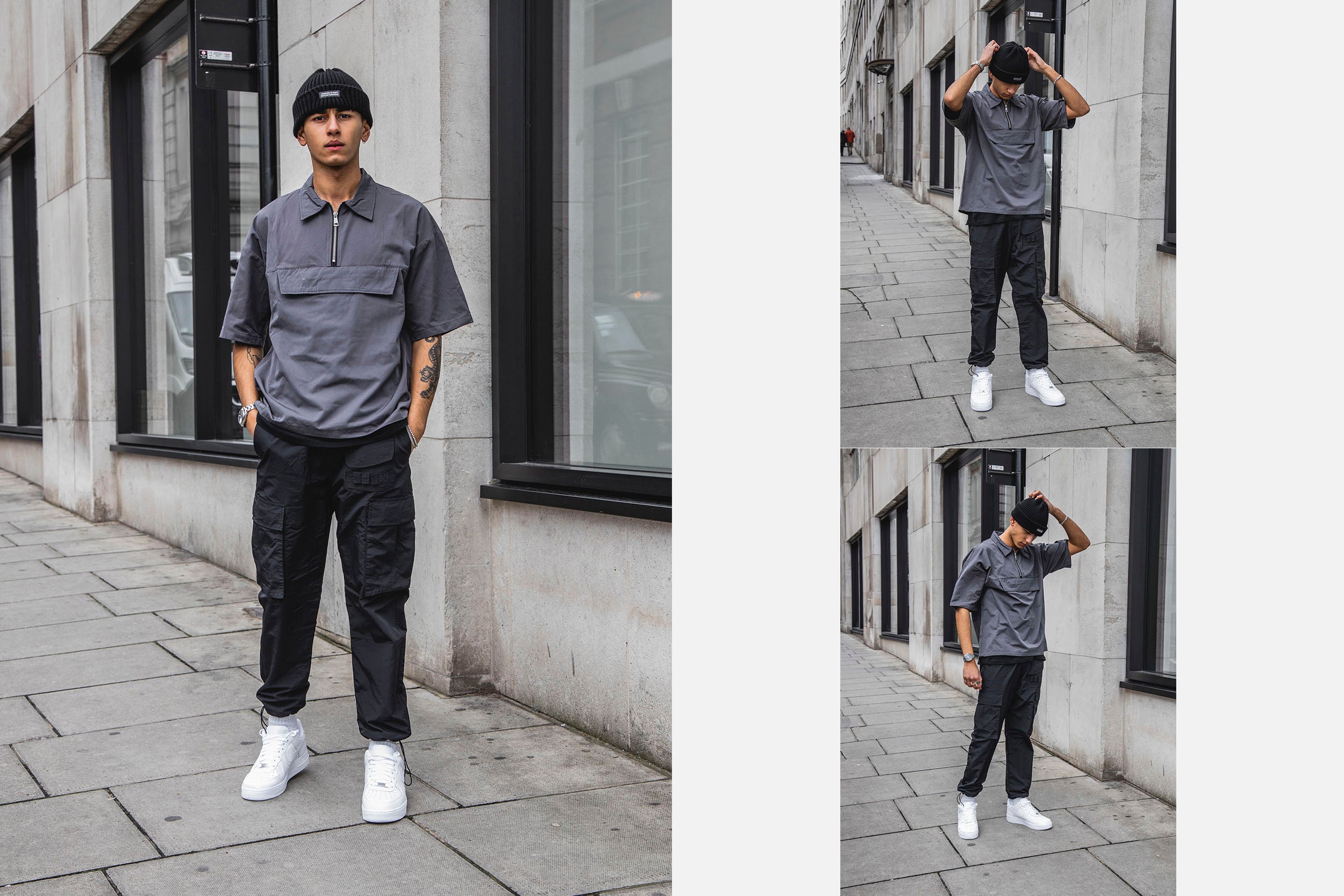 A male model wearing black cargo pants standing on the street.