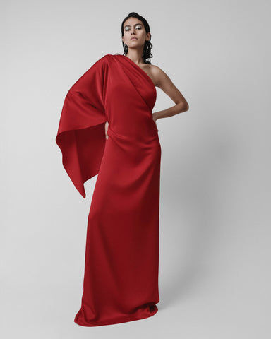 red one shoulder draped gown