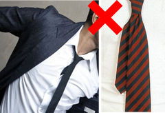 loose tie tail or tucked in shirt 