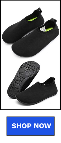 A pair of black children’s water shoes with rubber soles and breathable fabric.