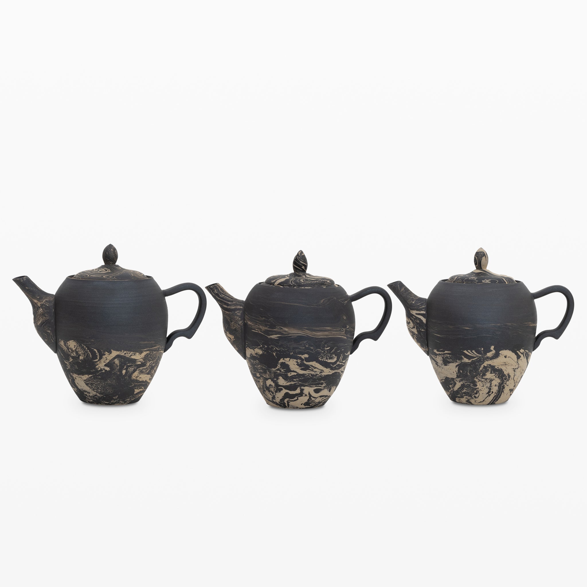 https://cdn.shopify.com/s/files/1/0012/4072/7612/products/gena-kuwan-ceramic-teapot-black-961497.jpg?v=1699623023&width=2048