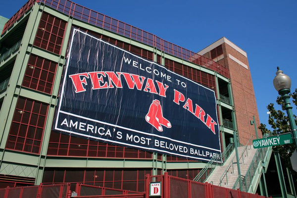 A sign outside of Fenway Park in Boston, one of the most iconic baseball road trip stops