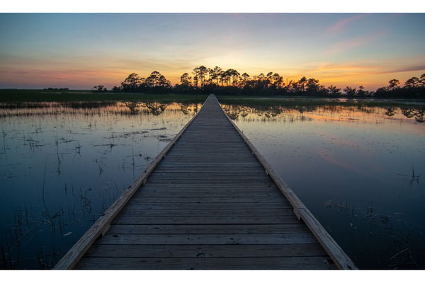 A dock on the water at Hunting Island State Park in South Carolina, one of the best US state parks