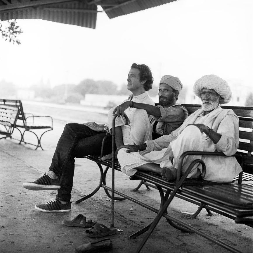 John waiting for a train in India. Photo by Jonas Spinoy.