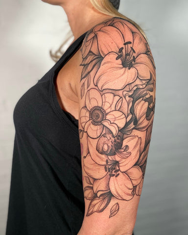 Floral tattoo designed by Lu Loram Martin in Toronto, Canada.