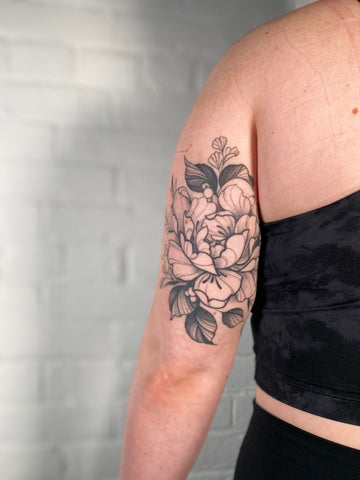 Healed floral tattoo by female artist Lu Loram Martin, in Toronto, Canada.