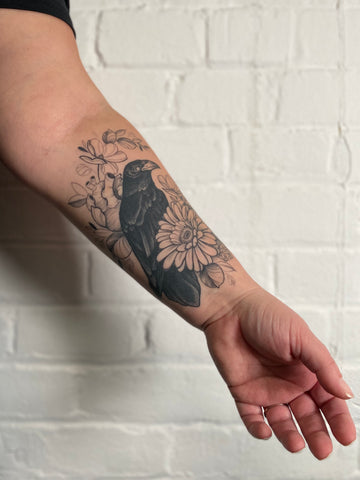 Raven tattoo by floral artist Lu Loram Martin, in Toronto, Canada