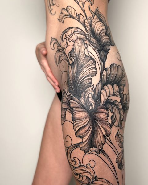 Beautiful feminine floral iris hip tattoo by floral tattoo artist, Lu Loram-Martin, in Toronto, Canada