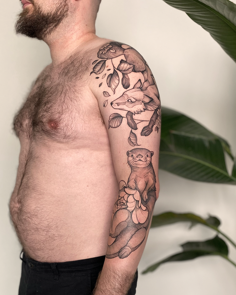 Beautiful patchwork male sleeve floral tattoo with fox, otter and peony by floral tattoo artist, Lu Loram-Martin, in Toronto, Canada