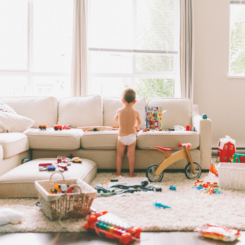 toddler playing in living room