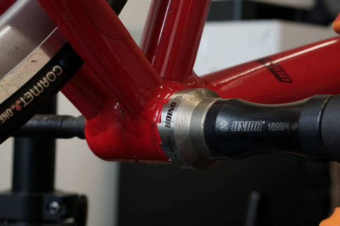 A bottom bracket shell being faced with a Unior facing tool