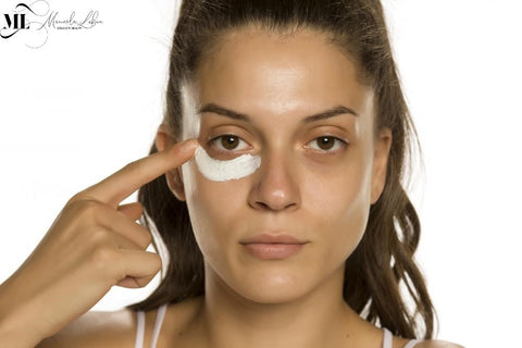 Woman apply anti-aging under-eye cream - ML Delicate Beauty