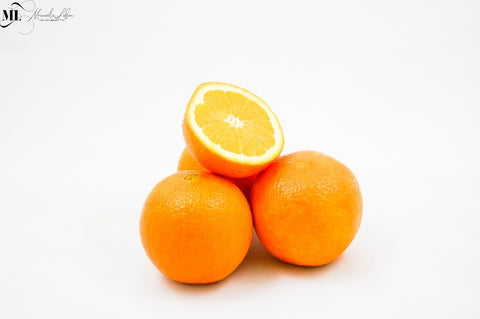 Oranges on a white surface - Vitamin C Skincare