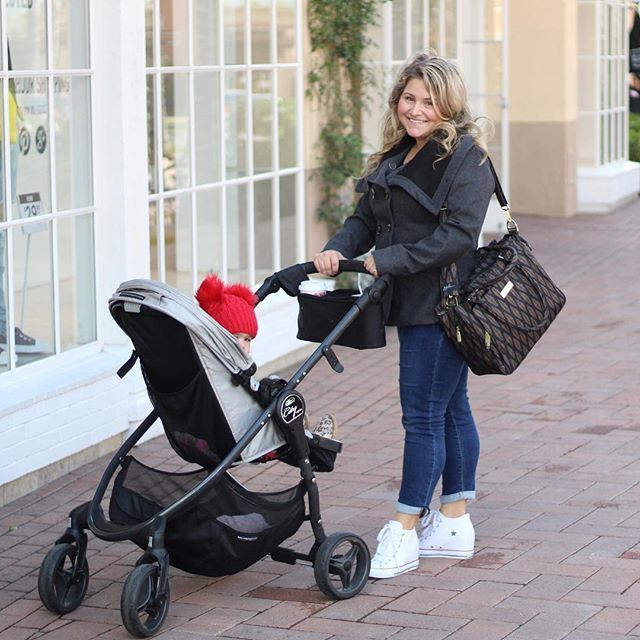 Mom poses with her stroller