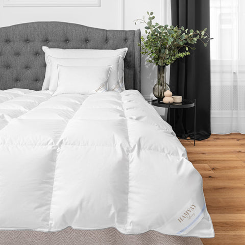 goose down bedding on a stylish grey bed