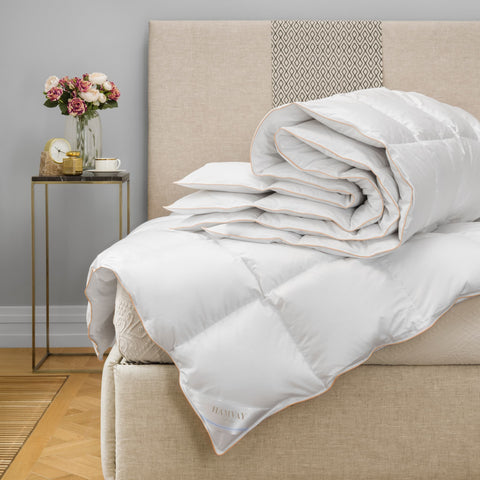 Hamvay-Láng goose down comforter folded on a bed