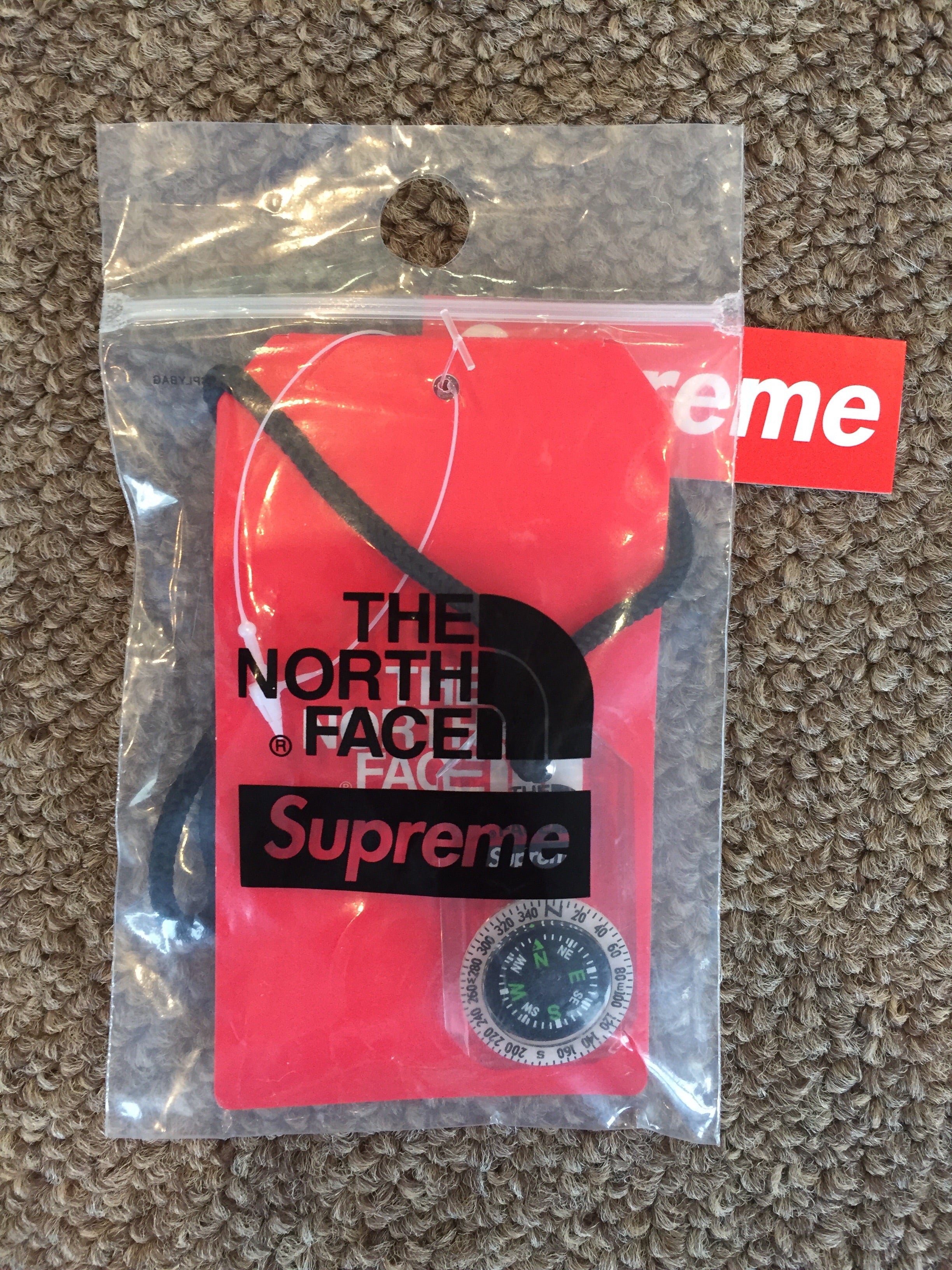 north face supreme compass
