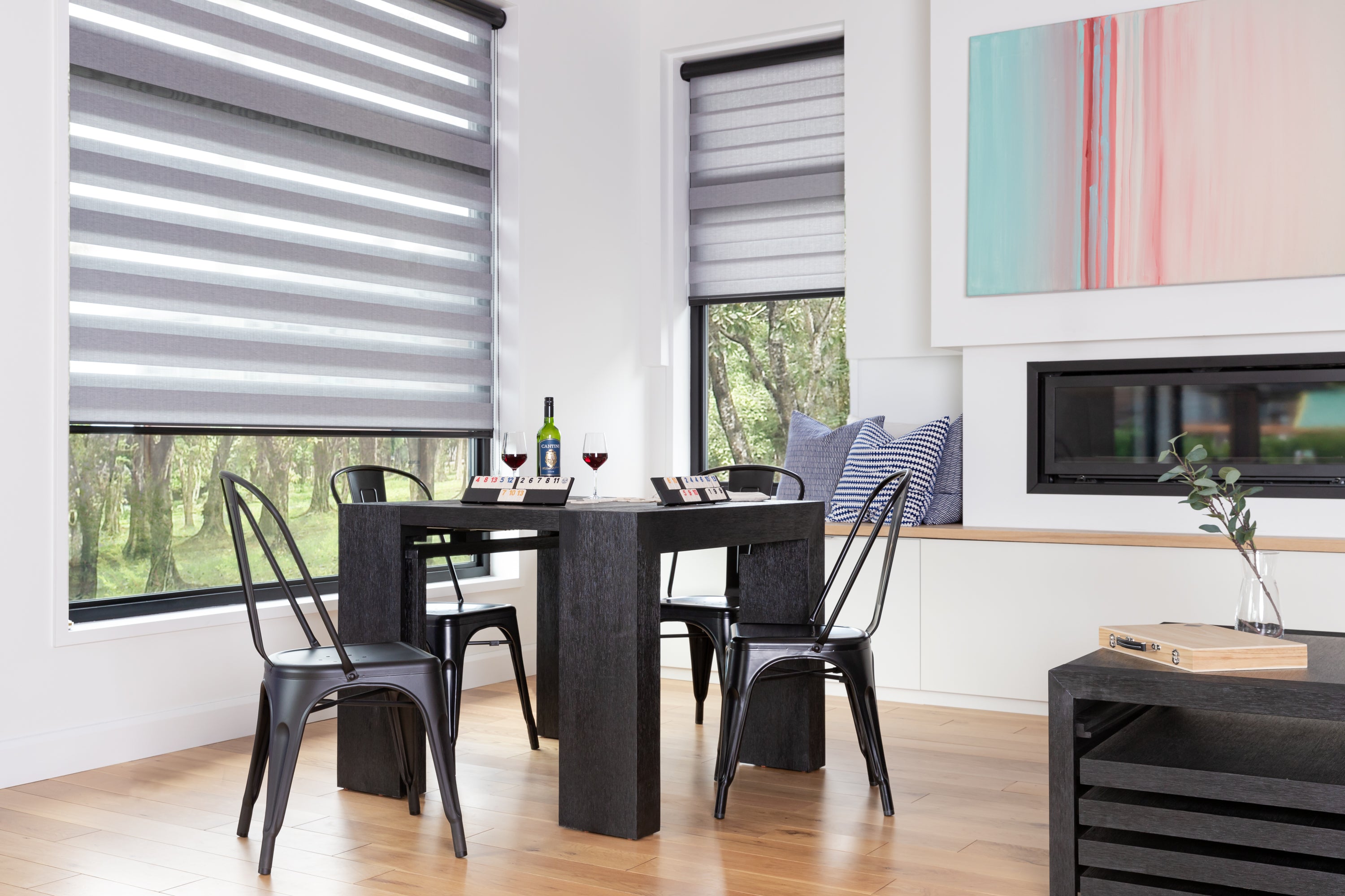 A modern kitchen table in a well lit kitchen.