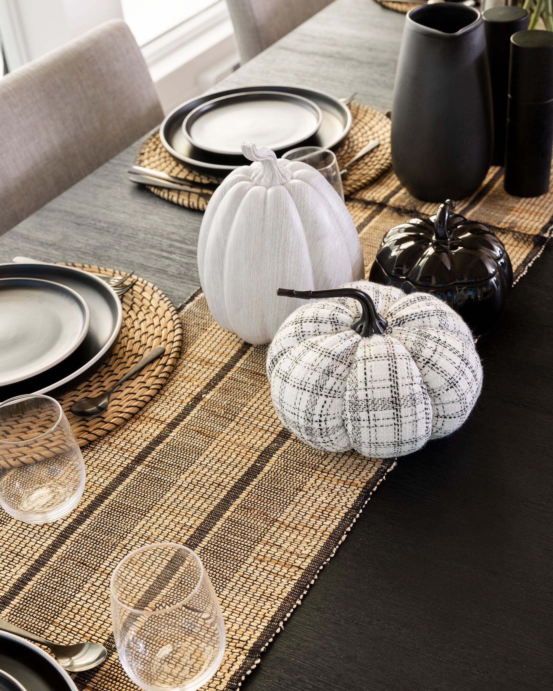 In this tablescape, we chose to use a variety of different materials for our pumpkin decorations to add more depth to the arrangement. Carved pumpkins are fun, but boho Halloween decor adds a level of chic that can really elevate the look of your tablescape. 