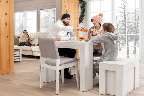 A family sitting at a dining room