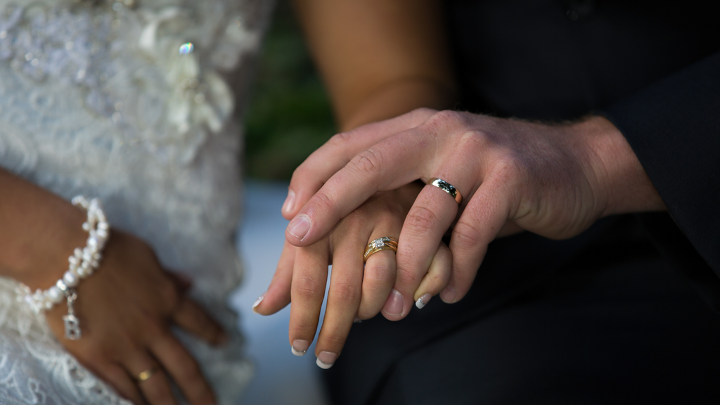 Bride and Groom Wearing Rings