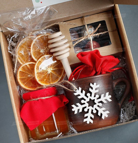 the perfect christmas present for a friend is a simple christmas box with christmas mug and other christmas gifts