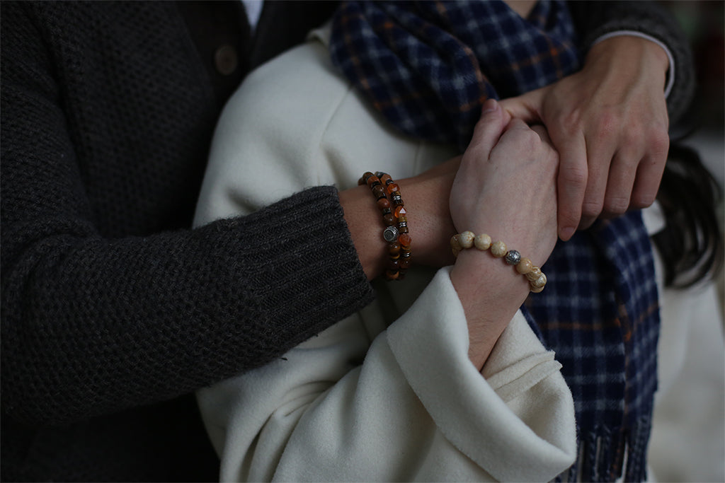 a couple with matching couple bracelets. Couple bracelets that maintain long distance relationships. different types of beaded bracelets for couples as relationship bracelets