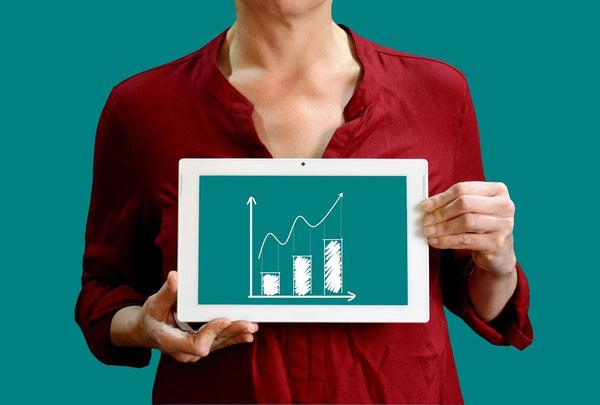 A woman holding a graph image