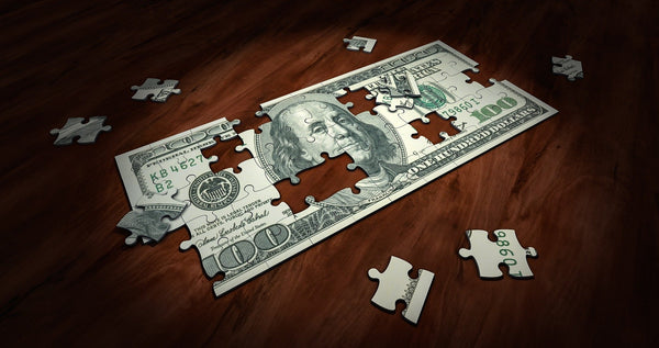 A jigsaw puzzle with an image of money 