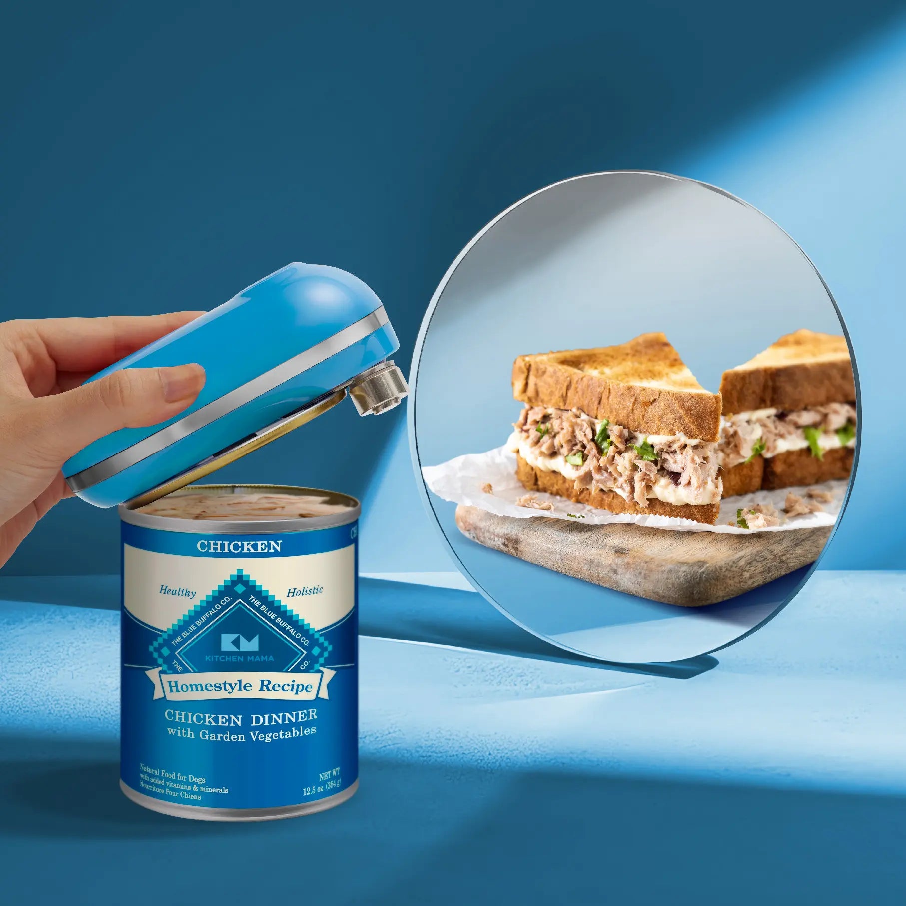 A person uses a blue can opener on a can of chicken, with a delicious chicken sandwich reflection in a mirror beside it.