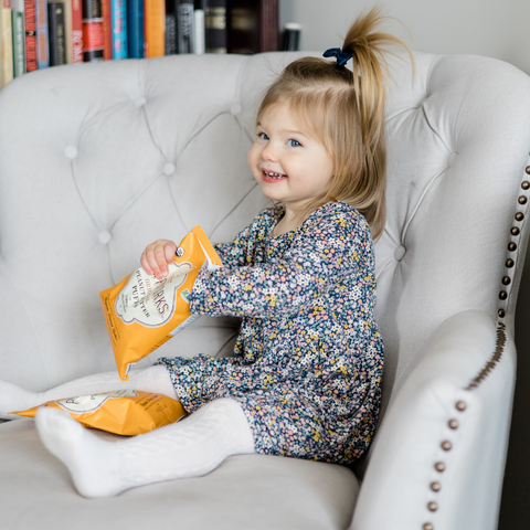 toddler with Puffworks original single serve kid puffs