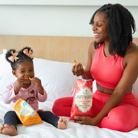 Woman with Daughter Sharing Puffs