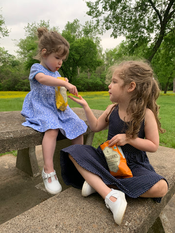 girls eating puffs