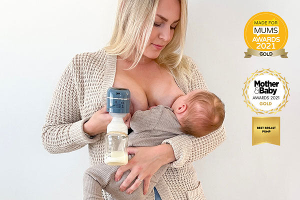 Mother using award-winning Lola&Lykke Smart Electric Breast Pump and breastfeeding her baby at the same time