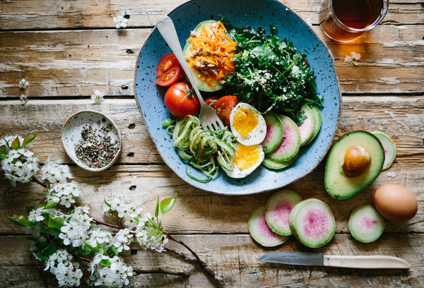 A plate filled with a variety of healthy foods suitable for breastfeeding mothers