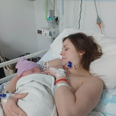 A mother nurturing her baby through breastfeeding after a c-section birth