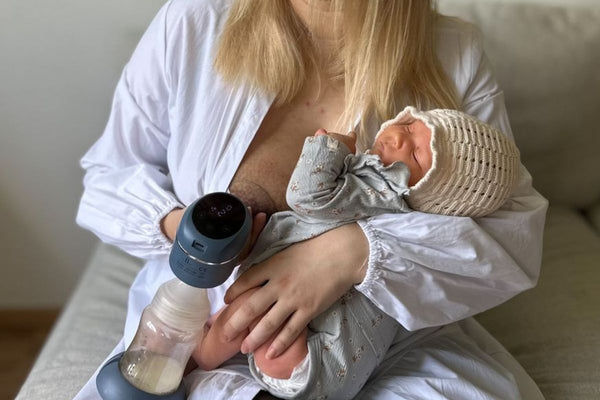 Mother using a breast pump to express milk following a cesarean section birth
