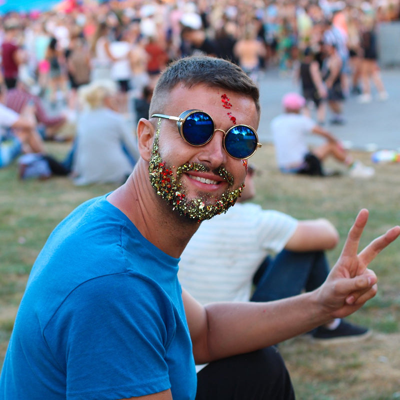 Man wearing mixed ultra sparkle glitter beard as a festival