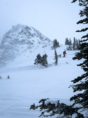 Splitboarder with mountain in background