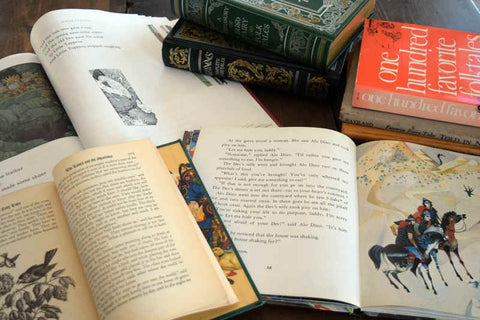 Several books of fairy tales - Hans Christian Anderson, Brothers Grimm, Norwegian Folk Tales, and others on desk