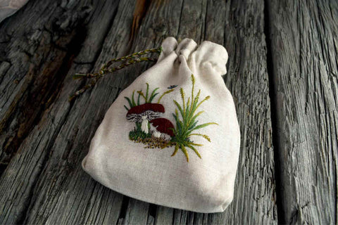 Linen pouch embroidered with winecap mushrooms, grasses, and dragonfly