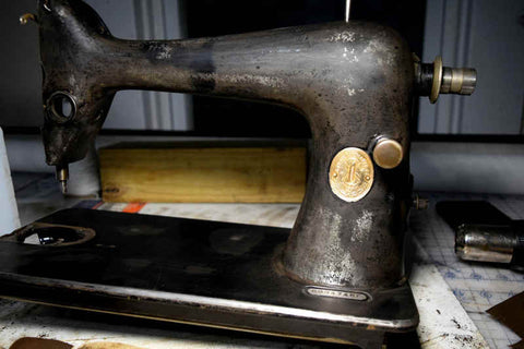 Singer 66 vintage sewing machine, sanded down to the paint and stripped of hardware in preparation for refinishing.