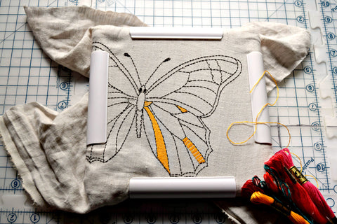 Embroidery frame with kantha worked butterfly in progress.