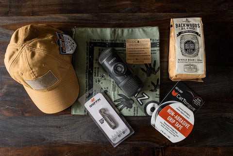 Scarf, hat, coffee, grip tape, and other camping list essentials. 