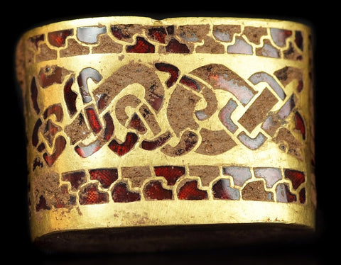 Seen here: "c. 8th century AD, Anglo-Saxon sword hilt fitting – gold with gemstone inlay of garnet cloisonné. From the Staffordshire Hoard, found in 2009, and not fully cleaned."