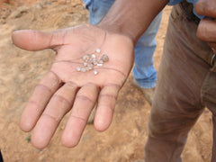 Rough Diamonds in a Miners Hand